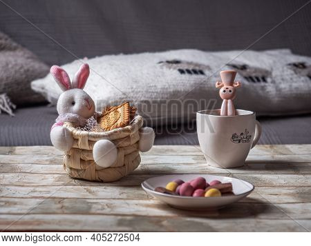 Easter Basket With A Hare And Cookies And A Talelochka With Chocolate Eggs For Easter