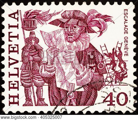 Moscow, Russia - January 20, 2021: Stamp Printed In Switzerland Shows Herald Reading Proclamation, E