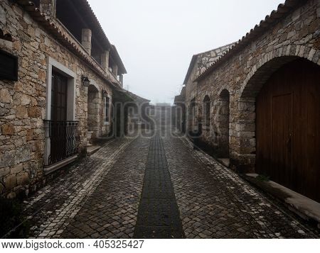 Old Historic Traditional Stone Buildings Exterior House Facade In Dense Fog Mood Pia Do Urso Batalha
