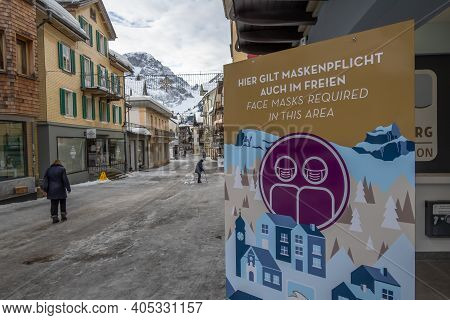 Engelberg, Switzerland - January 21, 2021: Covid-19 Warning That Protective Masks Must Be Worn In Th