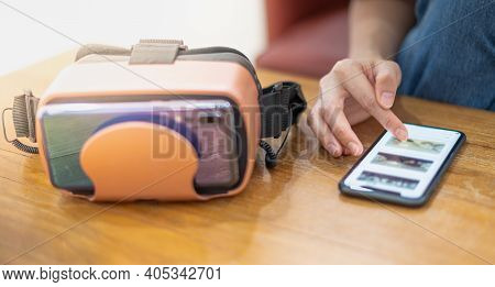 Female Hand Touching On The Gadget While Using With The Virtual Reallity , New Innovation For Modern