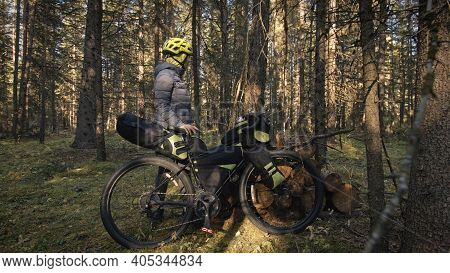 The Woman Travel On Mixed Terrain Cycle Touring With Bike Bikepacking. The Traveler Journey With Bic