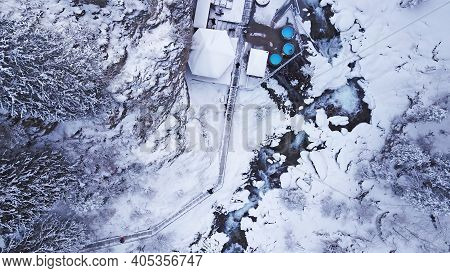 Hot Springs In The Snowy Forest And Mountains. Top View From The Drone On The White Gorge With The R