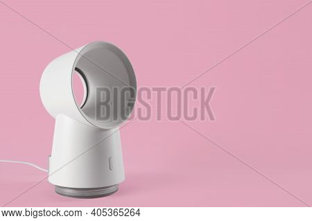 Modern Electric Fan On Pink Background. Space For Text