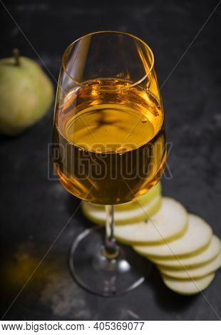 Amber Or Orange Wine Made From White Grapes. In A Tall Wine Glass. Georgian National Wine According 