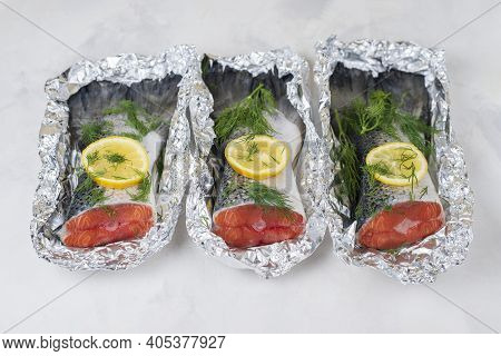 Fresh Raw Salmon Fillet Tail Part With Herbs, Lemon On A Light Background. Pescatarian Food Menu, Re