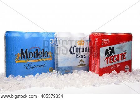 IRVINE, CALIFORNIA - MARCH 21, 2018: Three packs of 24 ounce Mexican Beers. Modelo Especial, Corona Extra and Tecate Original with ice.