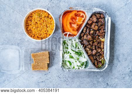 Turkish Take Away Kebab Liver With Onions And Tomatoes In Tabldot Foil Plate Served With Semolina Ir