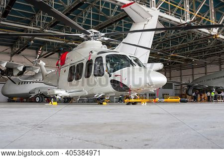 Moscow, Russia, July 02, 2013: Passenger Helicopter And Airplanes In The Hangar. Rotorcraft And Airc
