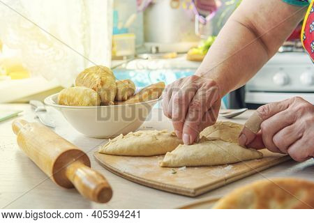 Grandma Cooks Pies. Home Cooked Food. Omemade Cakes Of The Dough In The Women's Hands. Process Of Ma