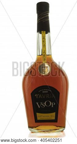 Poland, Warsaw - April 24, 2020: Cognac In A Bottle Of Tavria On A White Background