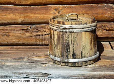 Old Wooden Tub With Lid. Container Made Of Wooden Planks And Covered With Hoops. Vintage Barrel For 