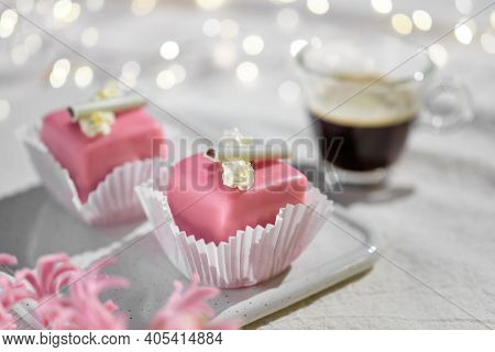 Valentine Petit Fours With Marzipan Icing And Cream Flowers. Espresso Coffee In Glass Cup. Garland O
