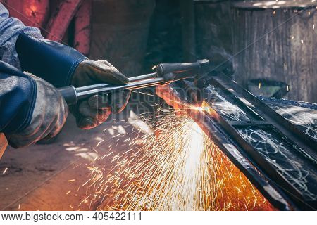 Close Up Hand Heavy Industrial Worker Is Working On Metal Work Factory Process By Cutting Sheet Stee