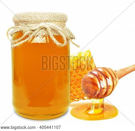 multiflorous honey in a jar, honeycomb and dipper