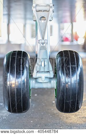 The Forward Landing Gear Of A Passenger Aircraft In The Air When Landing At The Airport.
