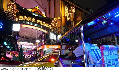 Bangkok, Thailand, 13 July 2019 Vivid Neon Sign Glowing, Nana Plaza Street. Nightlife In Erotic Red 