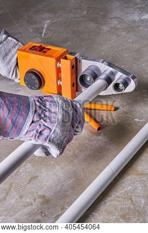 Soldering Iron For Polypropylene Pipes Next To Polypropylene Pipes And Gloves