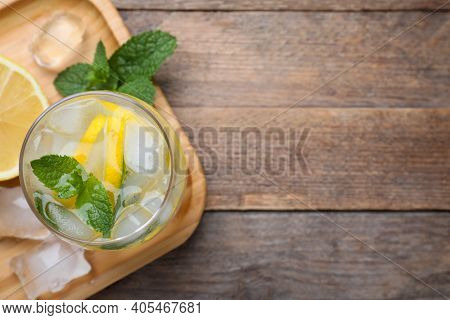 Delicious Lemonade Made With Soda Water And Fresh Mint On Wooden Table, Top View. Space For Text