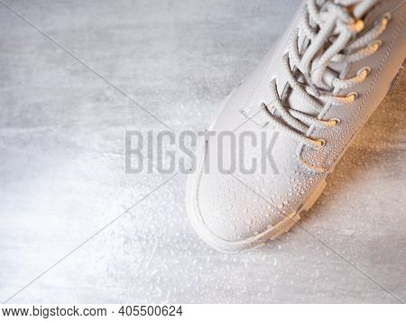 Water Droplets On Winter Shoe Protected With Waterproof Spray
