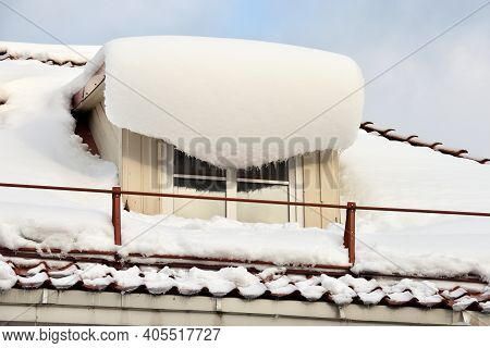 Window Covered With Snow After Snowfall. Lot Of Snow On The Window In Roof At Winter, Danger Snow