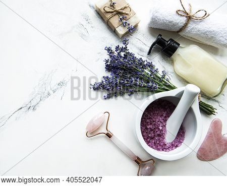 Flat Lay Composition With Lavender Flowers And Natural Cosmetic On Marble Background
