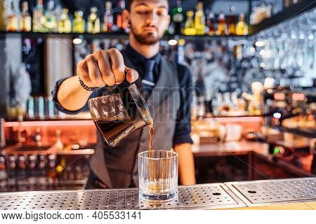 Close Up Of A Young Caucasian Bearded Male Barista Pouring Coffee Into Kalita Wave Dripper Coffee Fi