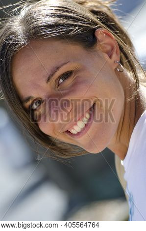 Candid Portrait Of Attractive Smiling Brunette With No Filters. Autentic People Concept Without Arti