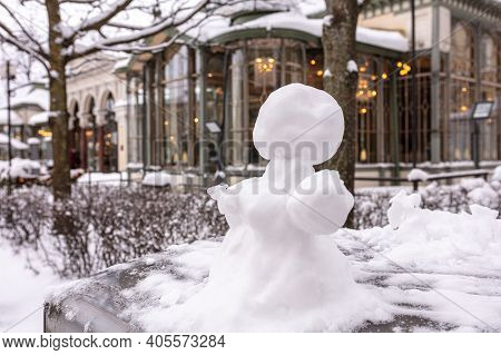 Snowman, Snow Woman Molded From Snow. Snowy Winter Concept. High Quality Photo