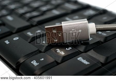The Usb Cable For Charging Peripherals Is Located On The Keyboard In Black. Charging For Your Phone