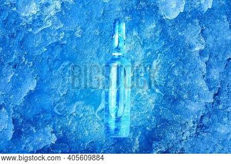 The Vaccine In A Glass Ampoule With A Clear Liquid With A Medical Preparation For The Treatment Of A