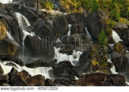 Russia. Mountain Altai. A Fragment Of The Uchar Cascade Waterfall On The Chulcha River, The Right Tr