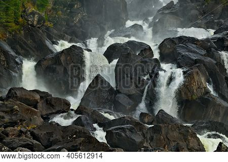 Russia. Mountain Altai. A Fragment Of The Uchar Cascade Waterfall On The Chulcha River, The Right Tr