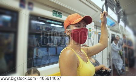 Woman Travel Caucasian Ride At Overground Train Airtrain With Wearing Protective Medical Mask. Girl 