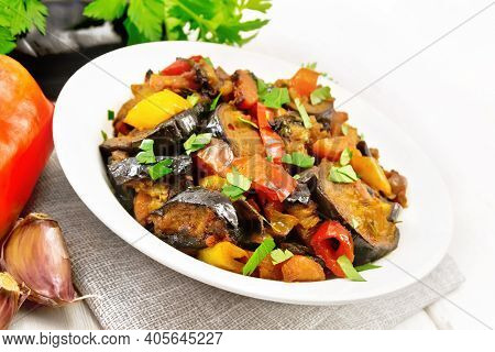 Ragout With Eggplant And Pepper On Light Board