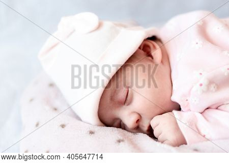 Childhood, Care, Motherhood, Health Concepts - Close Up Little Peace Calm Newborn Baby Girl In Pink 