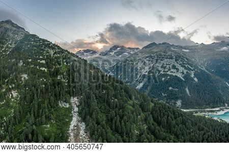 Aerial Drone Shot Of Schlegeisspeicher Resevoir With Galcier View At Dusk