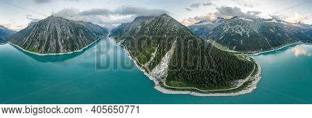 Aerial Panorama Drone Shot Of Schlegeisspeicher Resevoir With Galcier View At Dusk