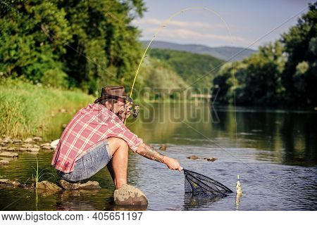 Big Game Fishing. Relax On Nature. Hipster Fishing With Spoon-bait. Fly Fish Hobby Of Man. Hipster I