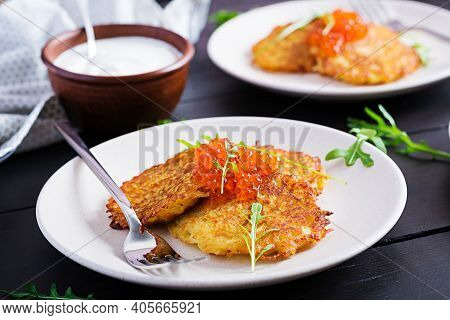 Fried Potato Pancakes With Red Caviar And Sour Cream, Fritter, Roesti. Traditional Delicious Food, L
