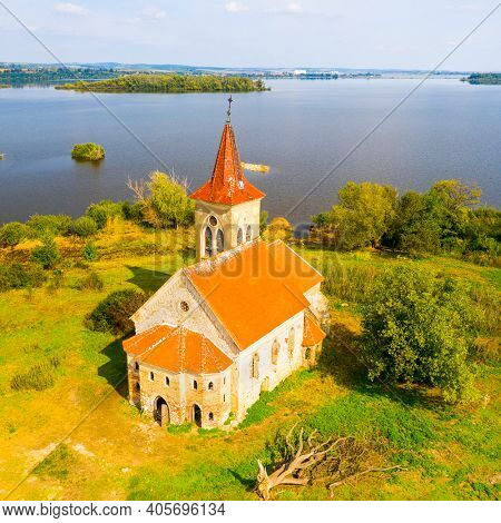 Gothic Church of St. Linhart on island in  Vestonice reservoir. Aerial view to famous landmark on South Moravia, Czech Republic.