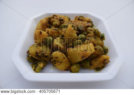 Selective Focus Of Indian Side Dish Curry Aloo Mattar Ki Sabzi, Popular Curry Made Of Potatoes And G