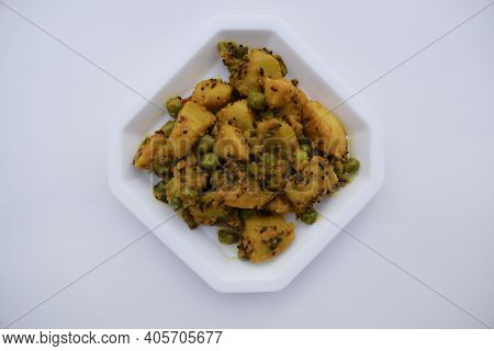 Selective Focus Of Indian Side Dish Curry Aloo Mattar Ki Sabzi, Popular Curry Made Of Potatoes And G