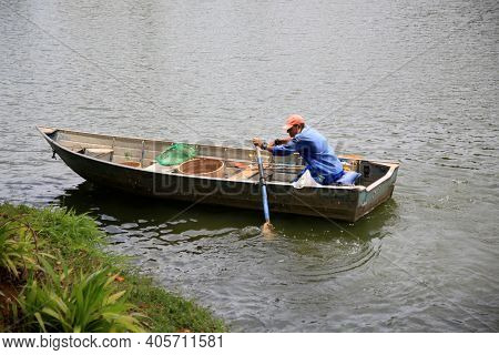 Fisherman On Lake Fishing