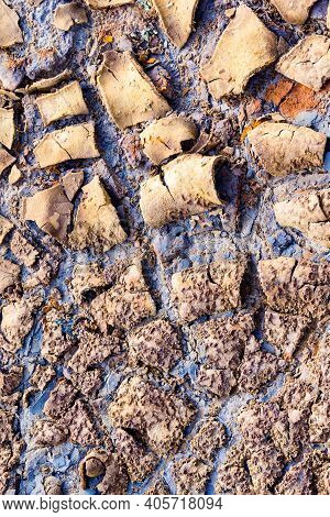 Texture Of Dry And Cracked Earth On The Banks Of The Rio Tinto