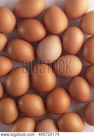 Brown Fresh Chicken Eggs In Carton . Closeup Natural Organic Egg Pattern. Healthy Real Food. Top Vie