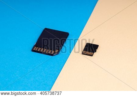 Sd And Micro Sd Memory Card On Blue And Yellow Background. Different Kind Of Portable Storage Device