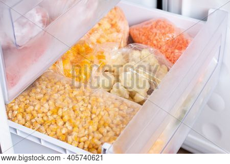 Frozen Vegetables In The Freezer. Frozen Corn, Cauliflower, Peppers. Frozen Food