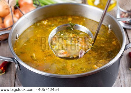 Russian Soup Rassolnik, Soup With Pickled Cucmbers, Pearl Barley In A Saucepan