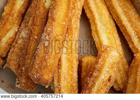 Traditional Churros Sticks With Cinnamon And Sugar Powder Set, Top View Flat Lay